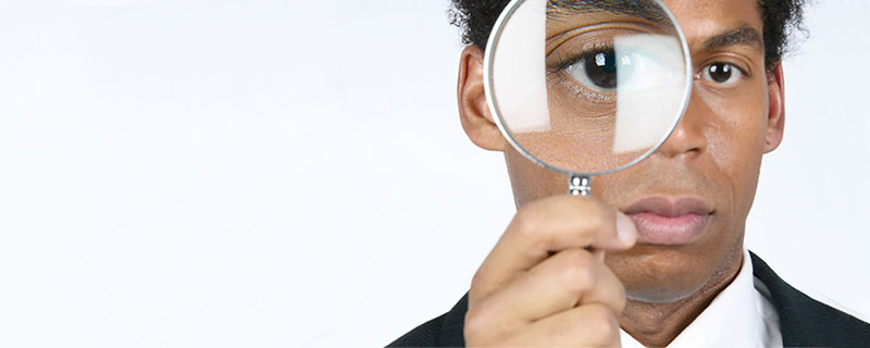 Man holding magnifying glass