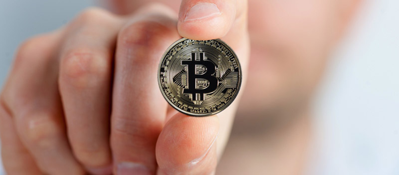 Woman holding a bitcoin