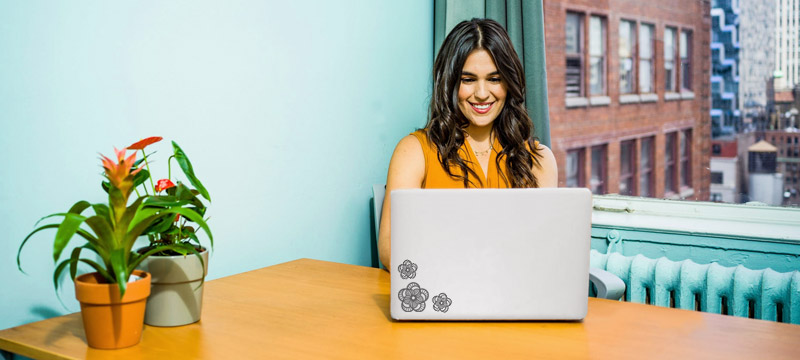 Woman sitting at computer taking an online focus group