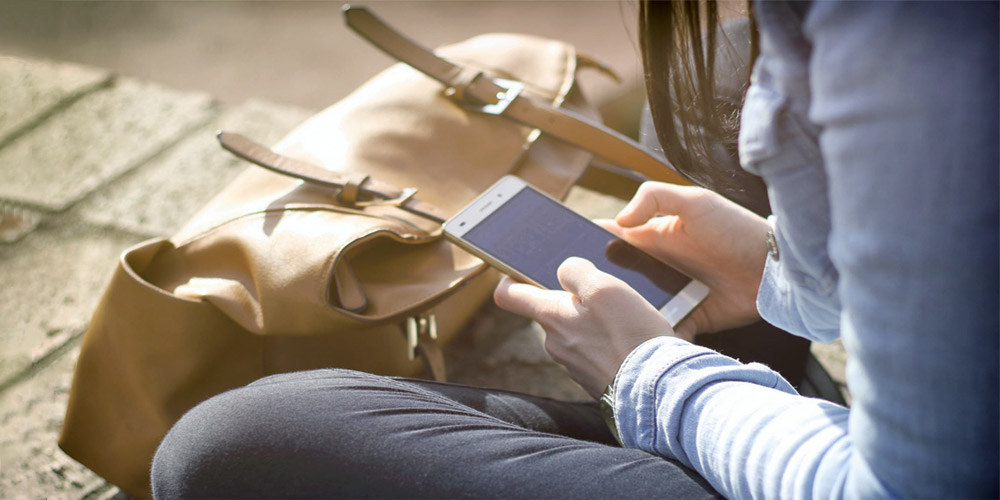 Woman taking surveys on her phone