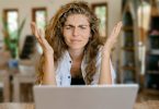 Survey taker sitting in front of computer