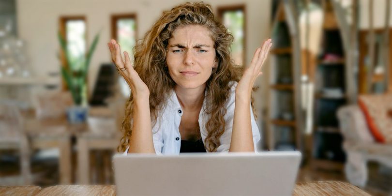 Survey taker sitting in front of computer