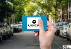 Person holding Uber gift card