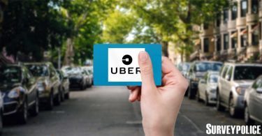 Person holding Uber gift card