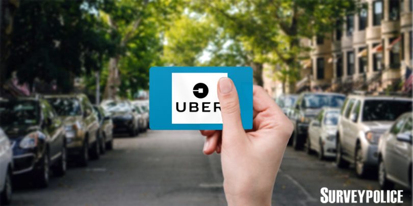 Person holding Uber gift card