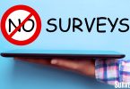 No surveys text above person holding tablet