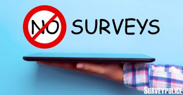 No surveys text above person holding tablet