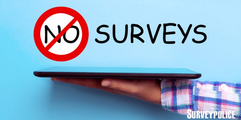 No surveys text above person holding tablet