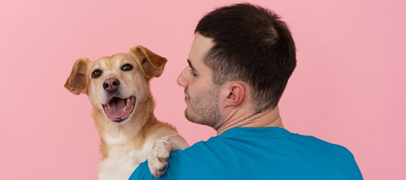 Man holding dog