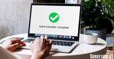 Bank transfer complete message on laptop
