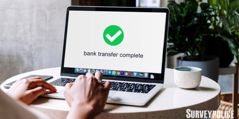 Bank transfer complete message on laptop