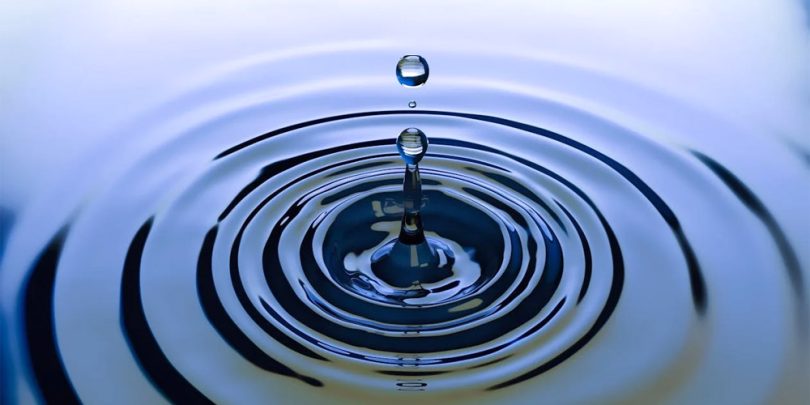 Water droplet causing a ripple