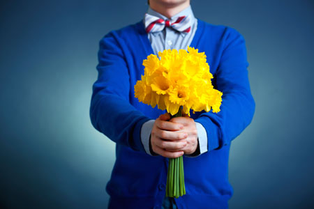 boy holding flowers