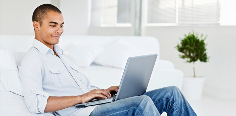 Comfortable male survey taker at his computer